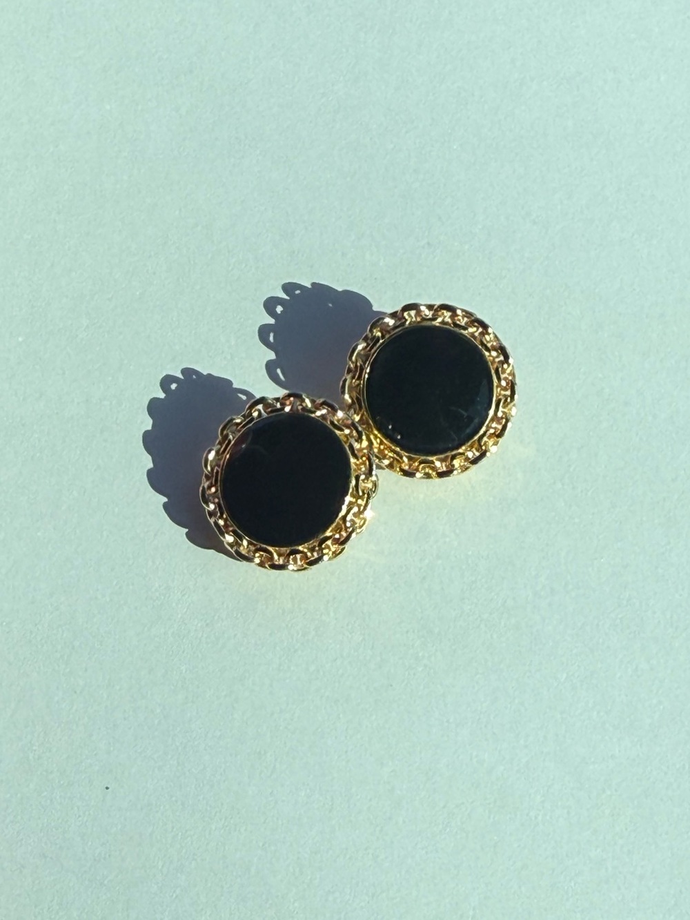 Vintage St. John chunky round gold tone and black clip on earrings